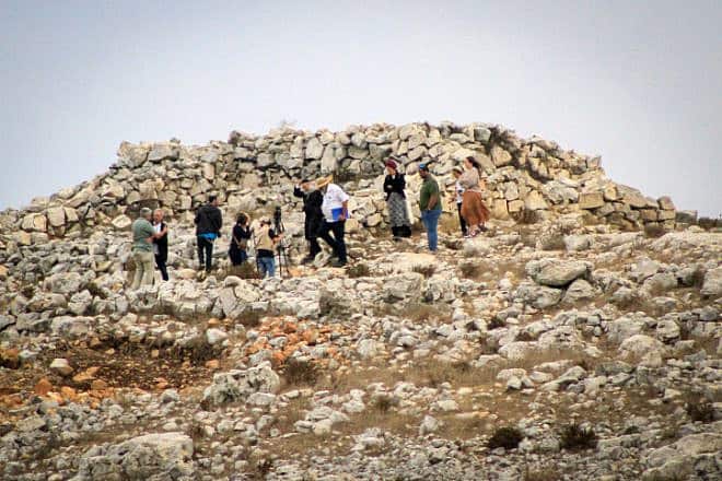 Jews raise Israeli flags on Mount Ebal in Nablus while on a visit to the altar of Joshua ben Nun during the Sukkot holiday, Oct. 02, 2023. Photo by Nasser Ishtayeh/Flash90.