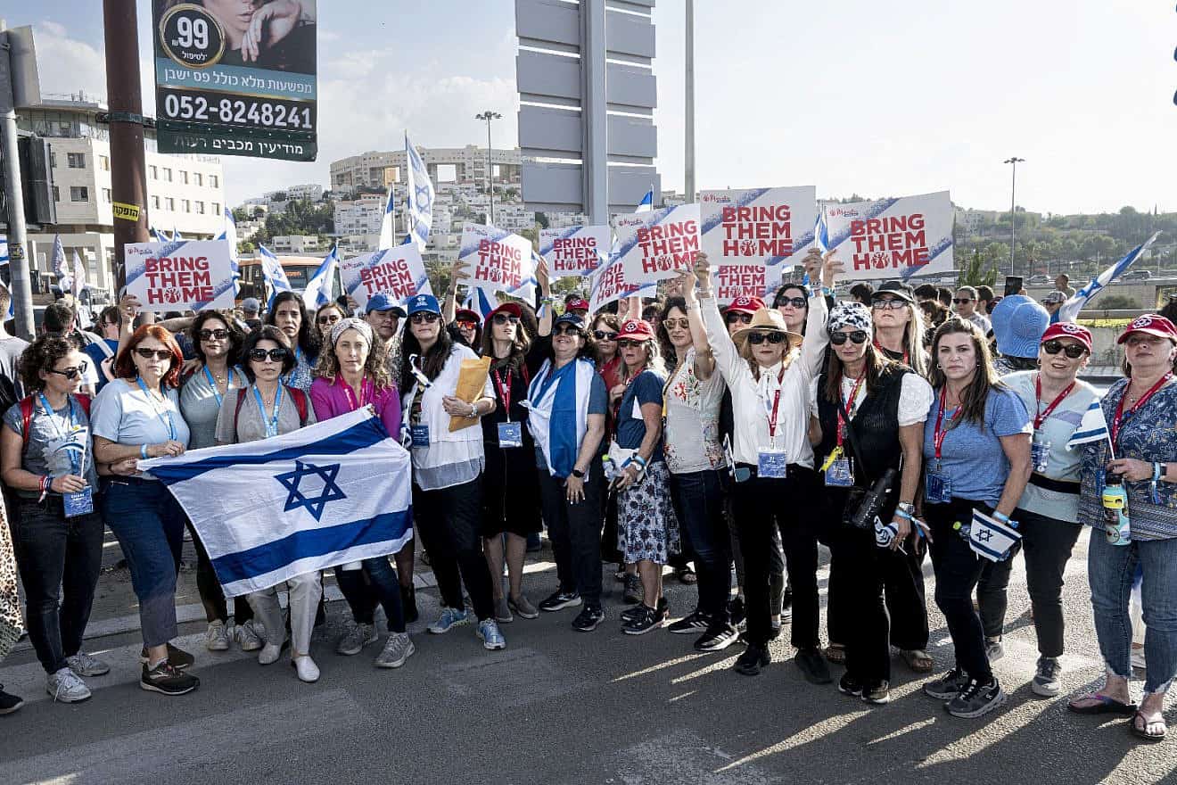 Momentum women join the families of captives in Gaza marching in Modi'in for their release, Nov. 16, 2023. Photo by Aviram Waldman.