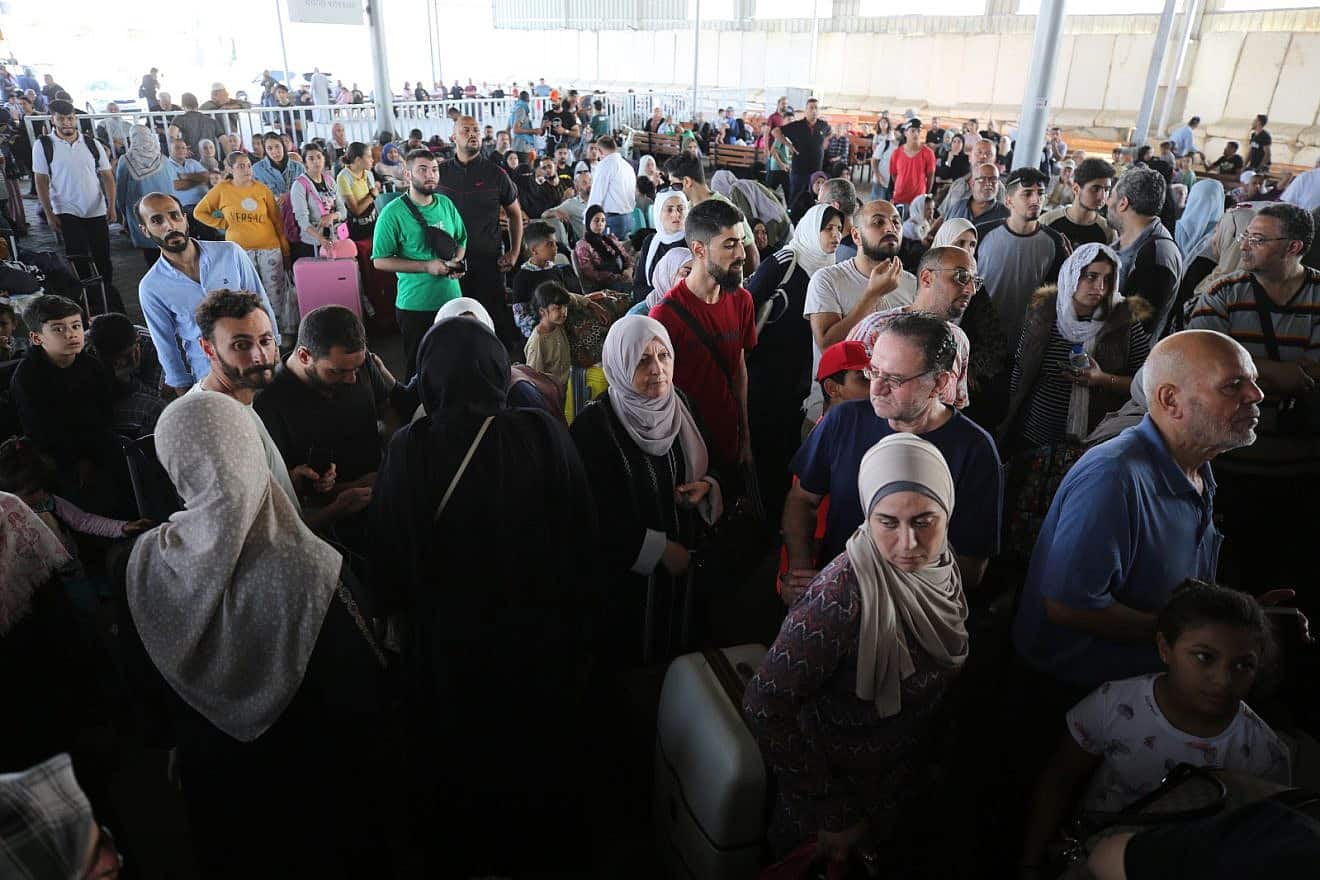 Foreign-passport holders wait to enter Sinai from the Gaza Strip after Egypt opened the Rafah border crossing for the first time since the war began, Nov. 1, 2023. Photo by Majdi Fathi/TPS.