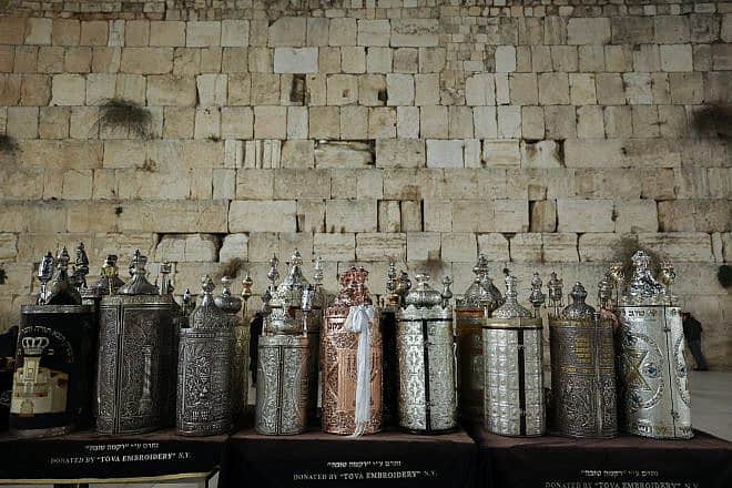 Two new Torah scrolls have been dedicated to the memory of Israeli civilians and soldiers killed in the Oct. 7 Hamas terrorist attacks and ongoing war, in addition to  the hostages being held in Gaza, at the Western Wall in Jerusalem's Old City, Nov. 21, 2023. Photo by Yonatan Sindel/Flash90.