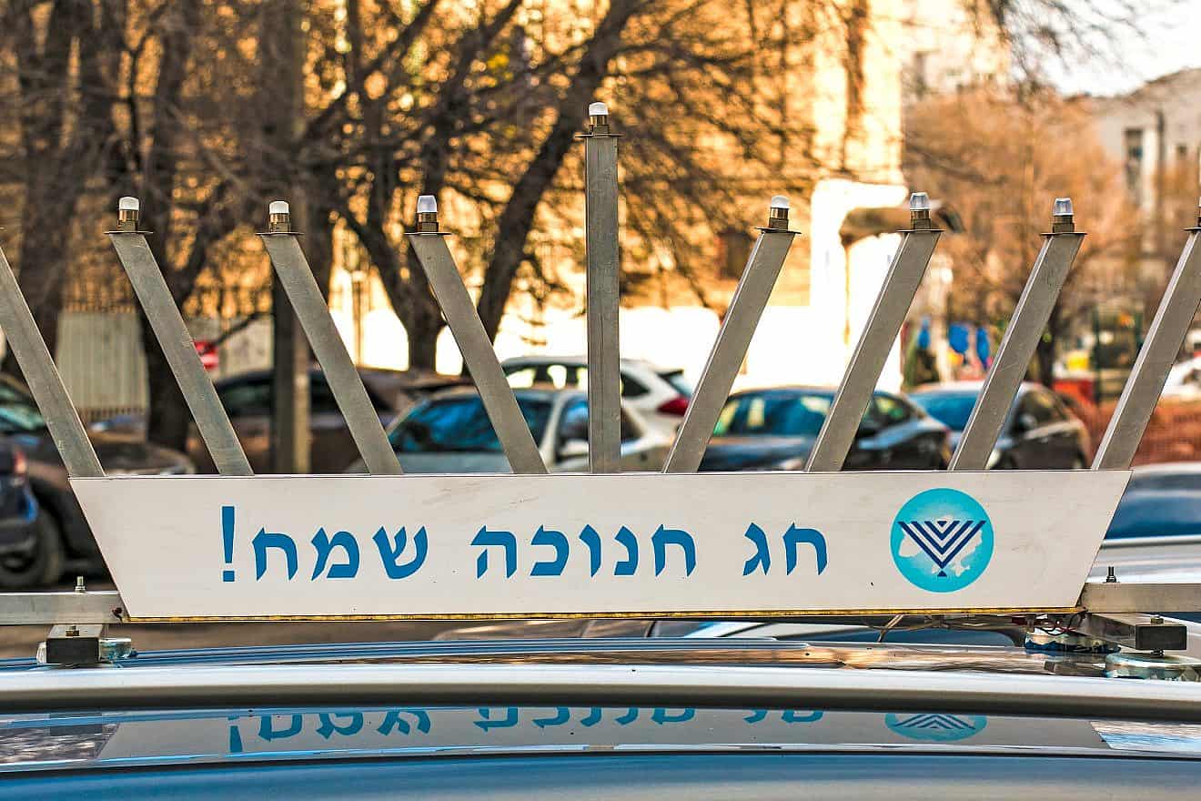 A Chanukah menorah display on a car in Dnepropetrovsk, Ukraine on Nov. 30, 2021. Credit: Oksana Kuznetsova Dnepr/Shutterstock.