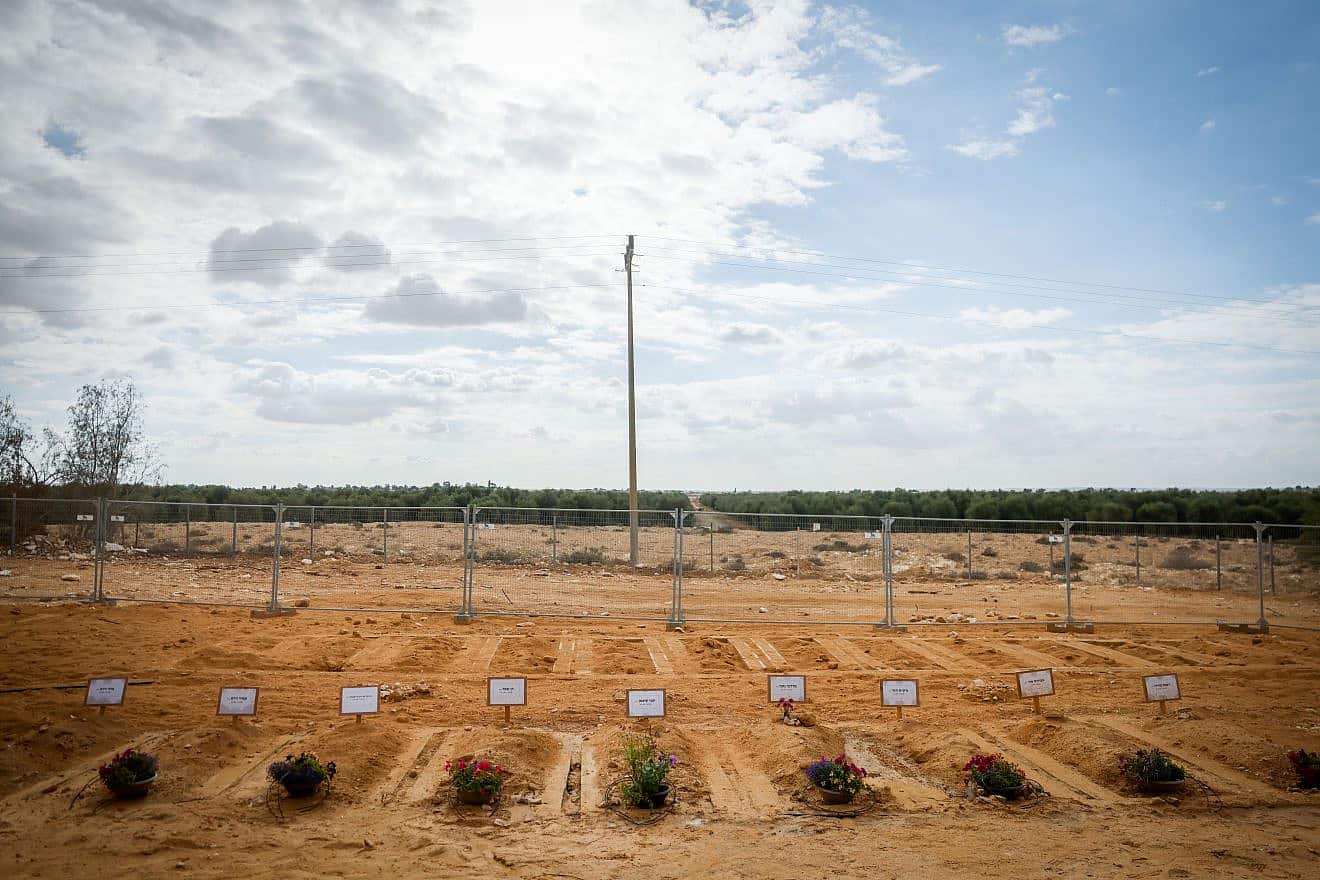Graves of Israelis who were murdered by Hamas terrorists on Oct. 7 in Kibbutz Be'eri, Nov. 15, 2023. Photo by Chaim Goldberg/Flash90.