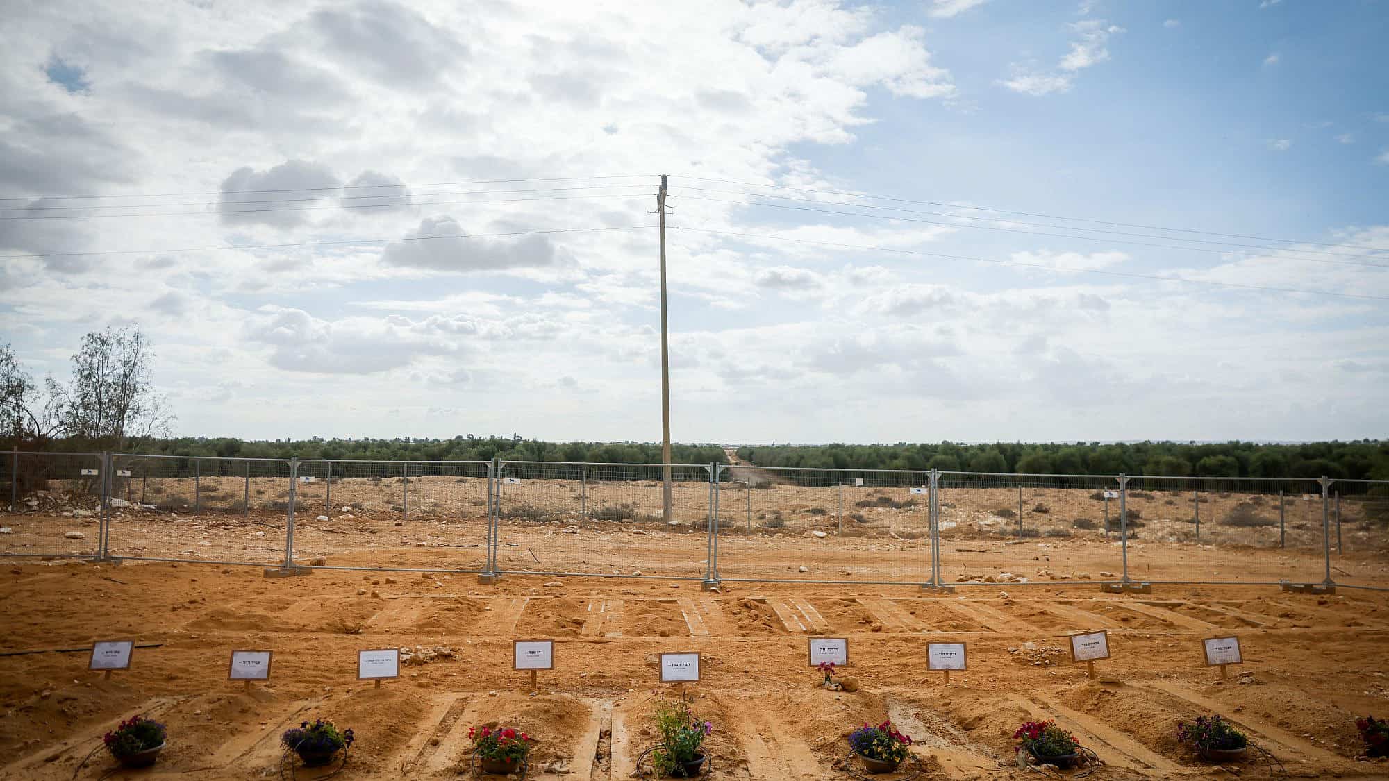 Graves of Israelis who were murdered by Hamas terrorists on Oct. 7 in Kibbutz Be'eri, Nov. 15, 2023. Photo by Chaim Goldberg/Flash90.
