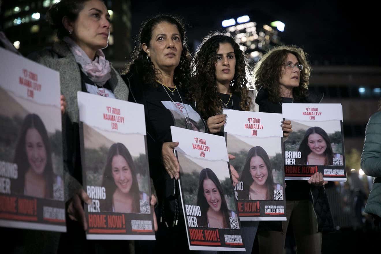 In Tel Aviv, relatives and friends of Israelis being held captive in the Gaza Strip by Hamas terrorists hold photos of their loved ones, Dec. 13, 2023. Photo by Miriam Alster/Flash90.