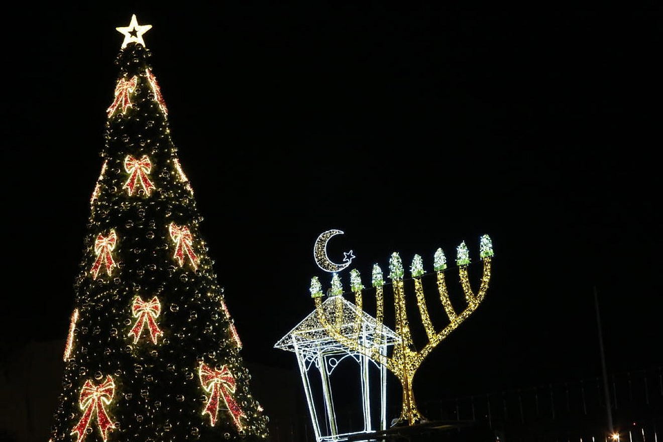 Haifa celebrates the “Festival of Festivals” marking Chanukah, Christmas and Ramadan, Dec. 21, 2022. Photo by Eitan Elhadez-Barak/TPS.