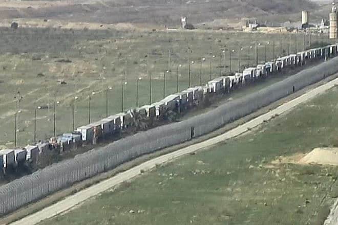 Trucks loaded with humanitarian aid for Palestinians in the Gaza Strip at a standstill outside the Rafah Crossing in Sinai. Credit: COGAT.