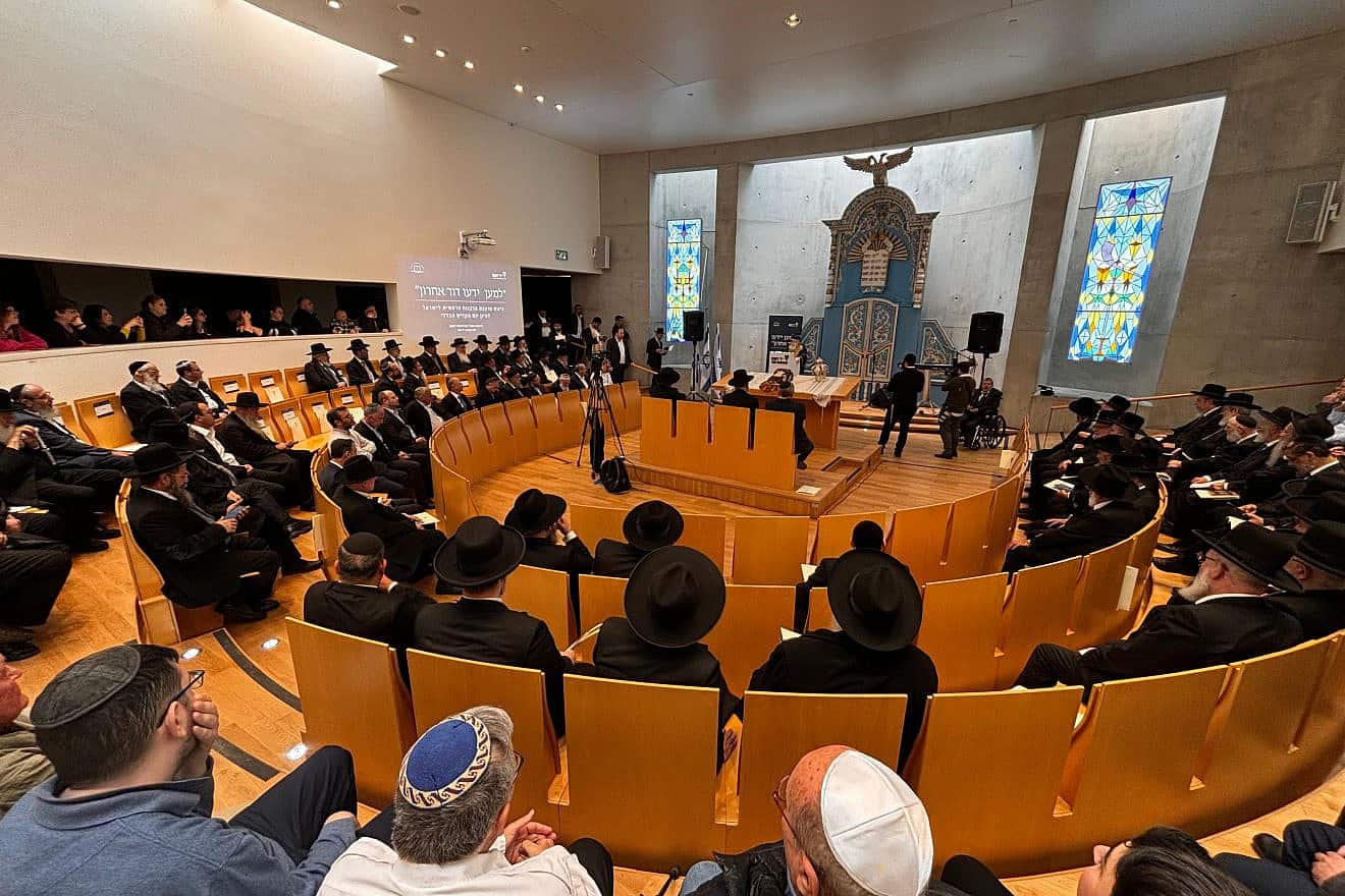 A Torah scroll hidden in the attic of a synagogue in Poland that was ransacked on Kristallnacht was placed in the Holy Ark at Yad Vashem, Dec. 21, 2023. Credit: Yad Vashem.