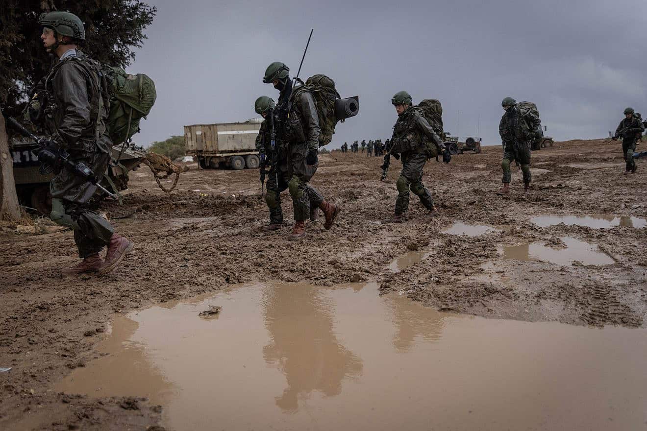 Israeli Defense Forces at a staging area before entering the Gaza Strip as part of a military operation on Dec. 13, 2023. Photo by Chaim Goldberg/Flash90.
