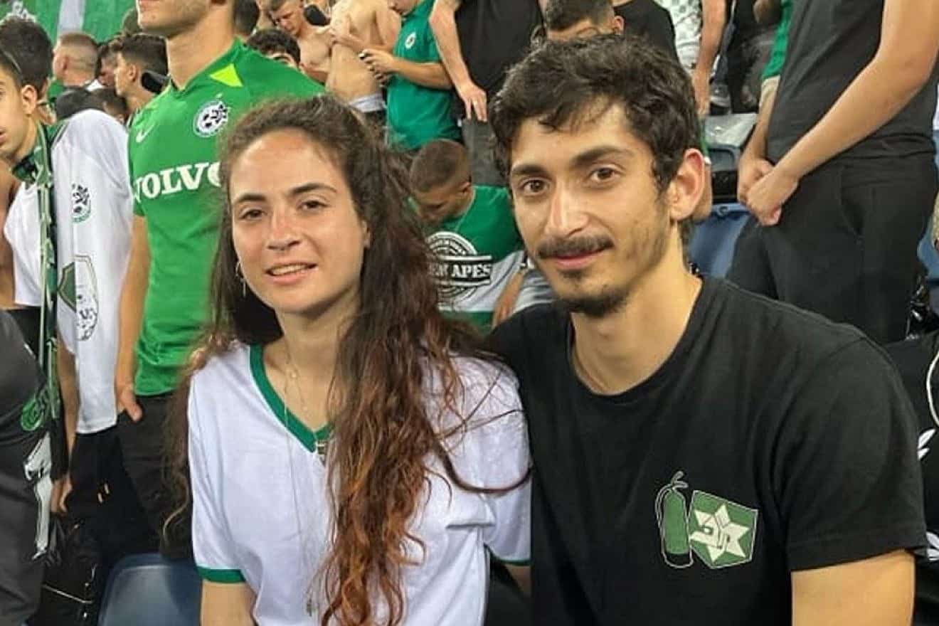 Inbal Haiman (left) with her partner Noam Alon at a Maccabi Haifa soccer game. Credit: Courtesy.