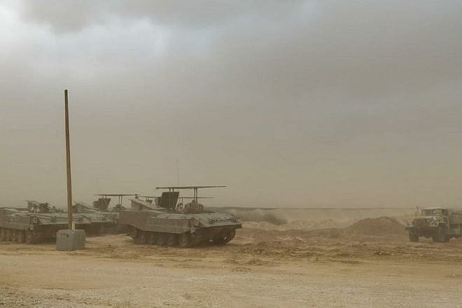 Kfir Brigade soldiers in armored personnel carriers near the Gaza Strip on Dec. 4, 2023. Credit: TPS.