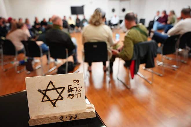 A Chanukah event, in Israel, which featured a group discussion, gave those newly orphaned on Oct. 7 a much-needed opportunity to speak about their experiences. Credit: Courtesy of OneFamily.