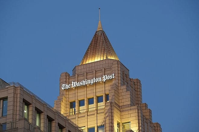 The sign atop “The Washington Post” building at night., Ja. 27, 2023. Credit: Phil Pasquini/Shutterstock.