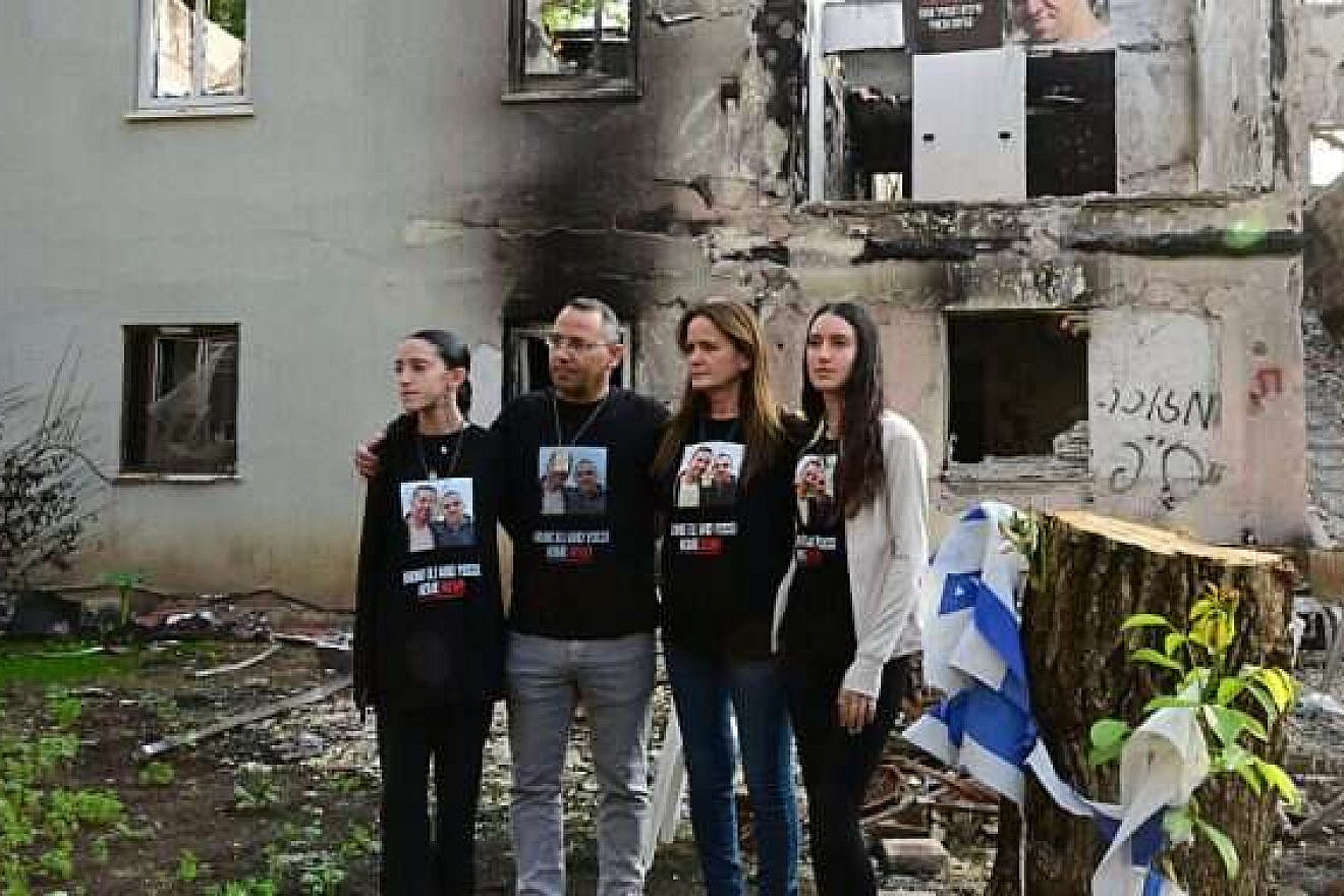 Former captives from Kibbutz Be'eri arrive at their home, which was destroyed in the Oct. 7 Hamas terrorist attacks in southern Israel. Photo by Yossi Zeliger.