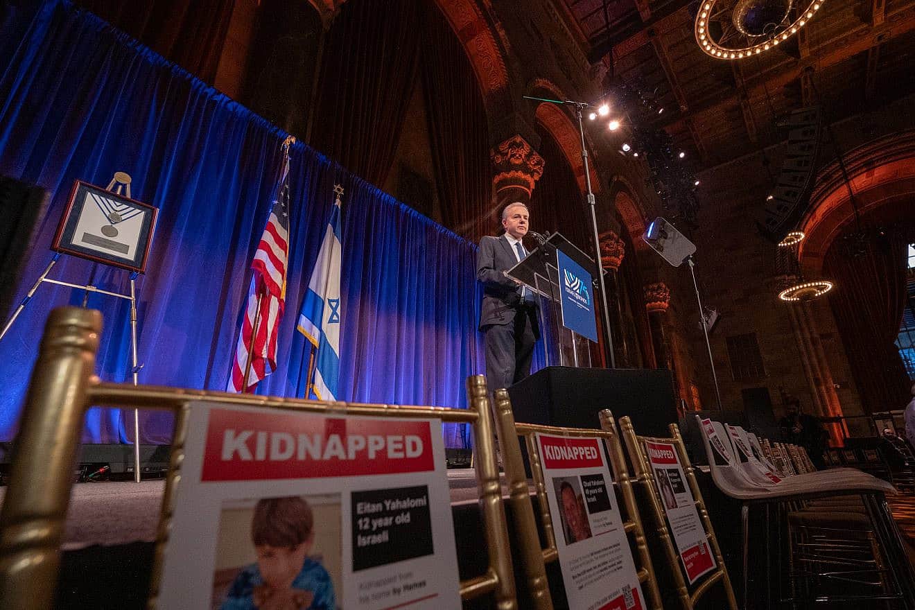 On November 13, 2023, Israel Bonds President & CEO Dani Naveh addresses guests at the organization’s Real Estate & Allied Division Luncheon in New York City, surrounded by empty seats in honor of the hostages abducted by Hamas. Photo by Shahar Azran. On November 13, 2023, Israel Bonds President & CEO Dani Naveh addresses guests at the organization’s Real Estate & Allied Division Luncheon in New York City, surrounded by empty seats in honor of the hostages abducted by Hamas. Photo by Shahar Azran.
