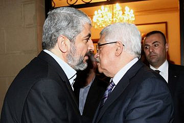 Palestinian Authority leader Mahmoud Abbas with Hamas leader Khaled Mashaal in Cairo on Feb. 23, 2012. Credit:  Mohammed al-Hums/Flash 90.