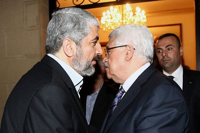Hamas leader Khaled Mashaal (left) with Palestinian Authority leader Mahmoud Abbas in Cairo on Feb. 23, 2012. Photo by Mohammed al-Hums/Flash90.