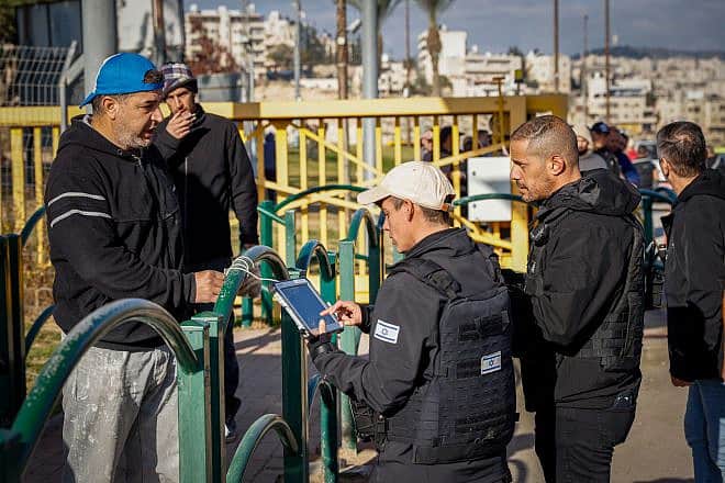 Palestinian workers enter the Israeli town of Ma’aleh Adumim following an attempted stabbing attack, Feb. 23, 2023. Photo by Erik Marmor/Flash90.