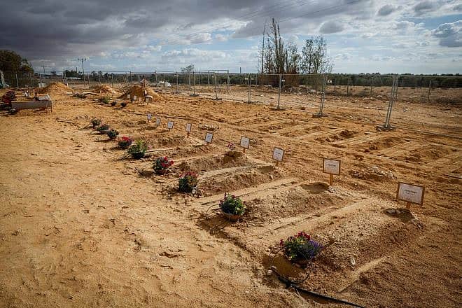Graves of Israelis who were murdered by Hamas terrorists on Oct. 7 in Kibbutz Be'eri, Nov. 15, 2023. Photo by Chaim Goldberg/Flash90.