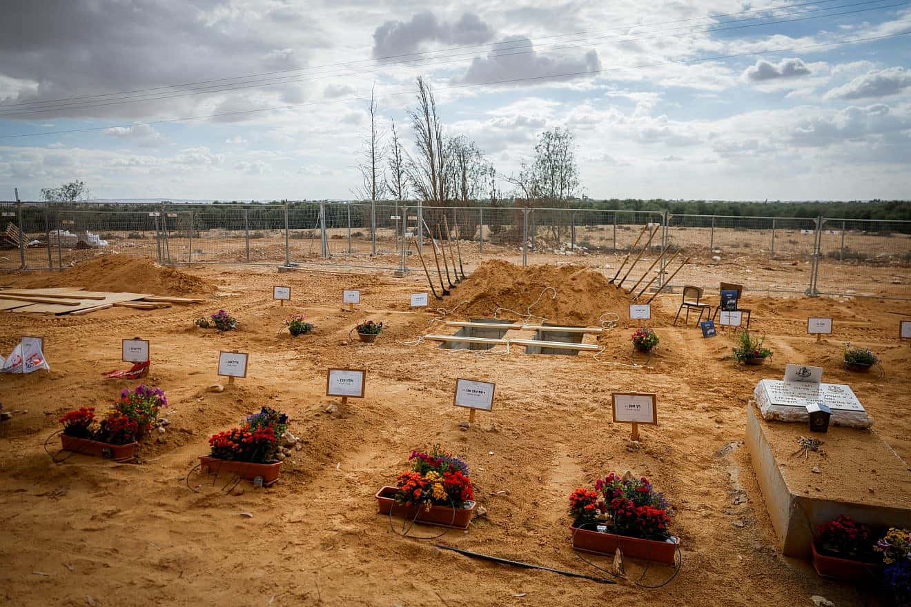 Graves of Kibbutz Be'eri residents who were murdered by Hamas terrorists on Oct. 7, 2023. Photo by Chaim Goldberg/Flash90.
