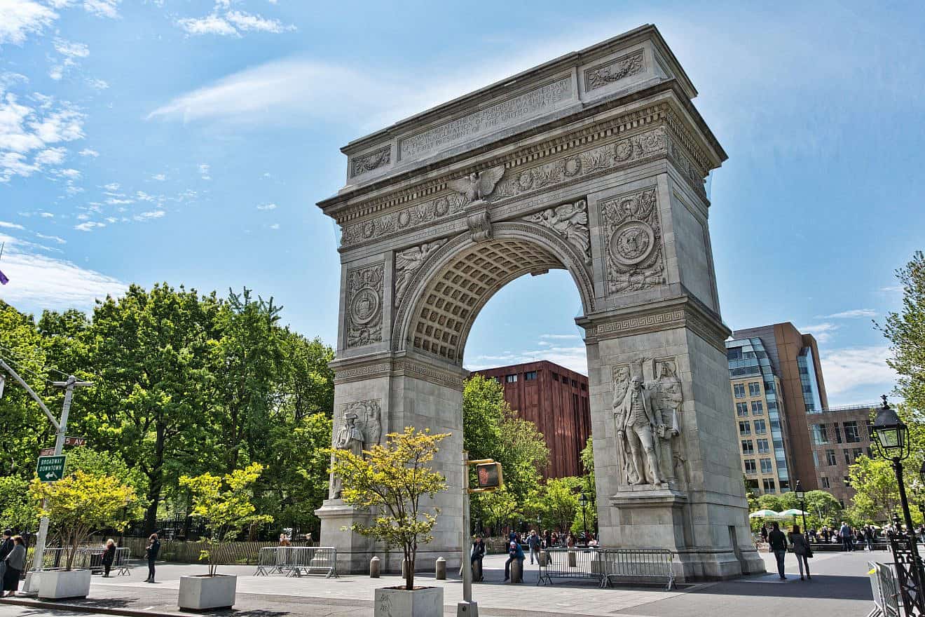 Washington Square Park, with its gateway arch, is surrounded by buildings associated with New York University. Credit: Jean-Christophe Benoist via Wikimedia Commons.