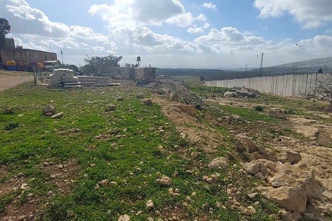Illegal Arab construction at the security barrier near Al-Ramadin in Judea. Credit: Courtesy.