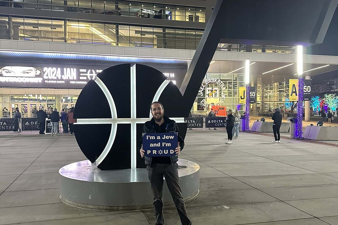 Chabad Rabbi Avremi Zippel (left) outside a Utah Jazz basketball game on Jan. 1, 2023. Source: X/Avremi Zippel.