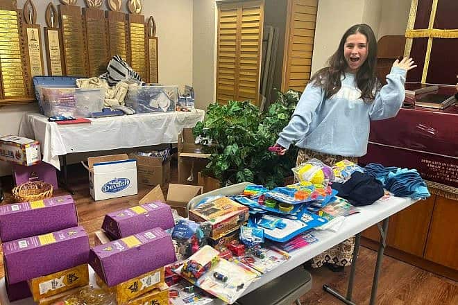 A CTeen member gets items together to send to displaced families in Israel due to events related to the war with Hamas since Oct. 7, 2023,, as part of a local U.S. initiative. Credit: Merkos 302.