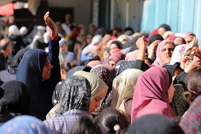 Palestinians line up outside a bakery in Deir al Balah, in the central Gaza Strip, to buy bread, Jan. 30, 2024. Photo by Majdi Fathi/TPS.