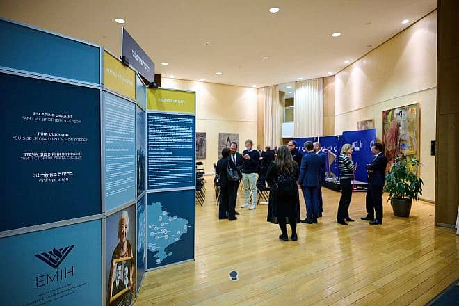 Fifty people gathered at E.U. headquarters in Brussels for the opening of an exhibition highlighting the world's response toward refugees from Ukraine, Dec. 22, 2024. Photo by Nicolas Lobet.