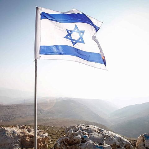An Israeli flag in the Jordan Valley, near the community of Ma'ale Efraim, Jan. 2, 2014. Photo by Uri Lenz/Flash90.