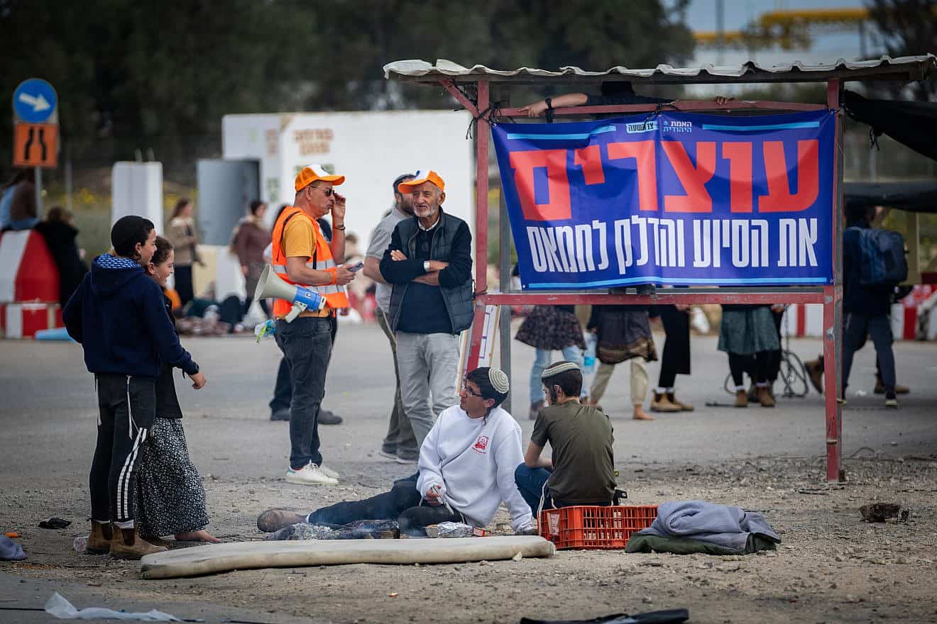 People protest against aid trucks entering Gaza at the Kerem Shalom border crossing in southern Israel on Feb. 22, 2024. Photo by Erik Marmor/Flash90.