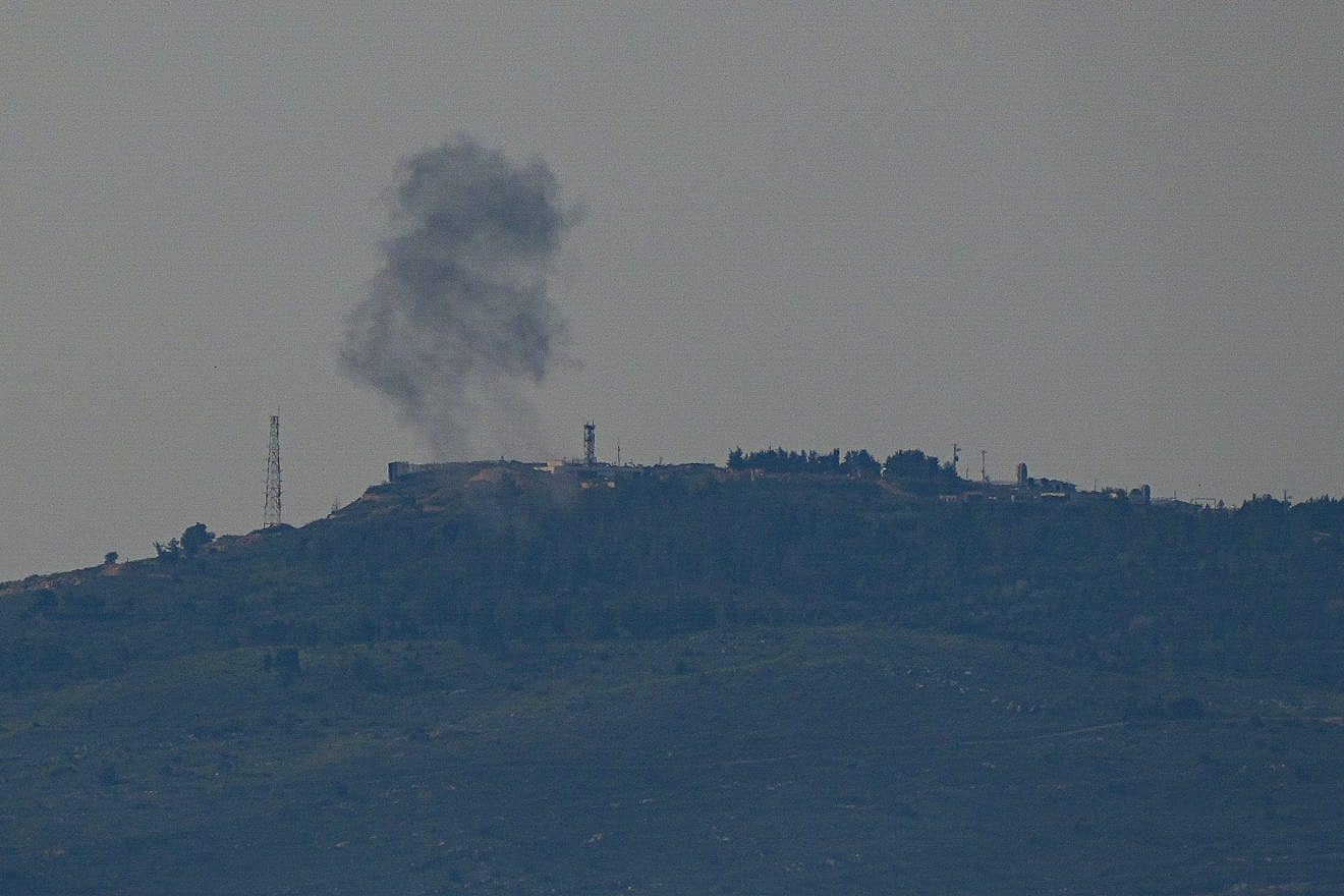 Smoke rises after rockets fired from Lebanon hit a military base near the Israeli border with Lebanon, Feb. 27, 2024. Photo by Ayal Margolin/Flash90.
