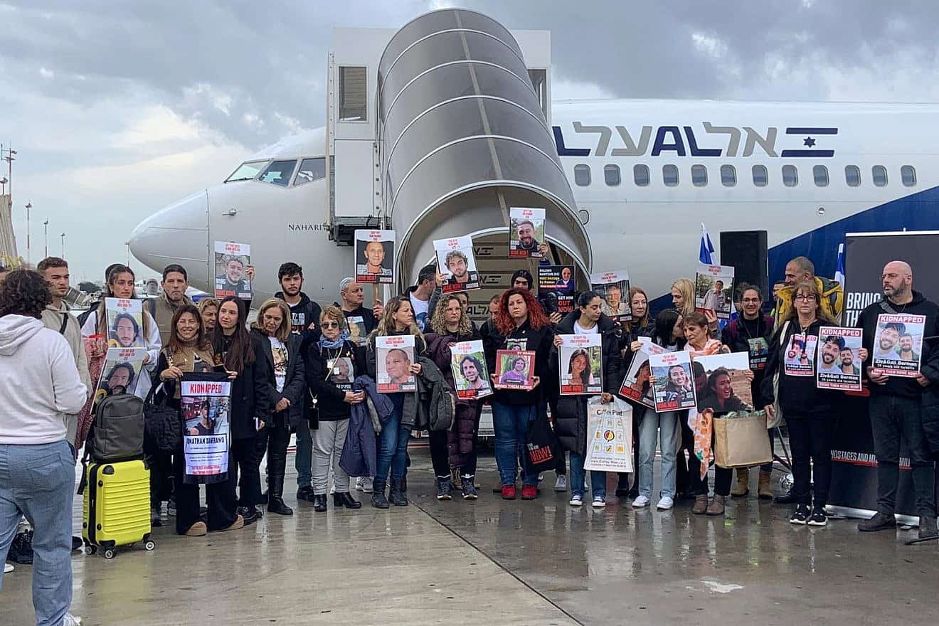 Families of captives in Gaza stand by the chartered plane that will take them to The Hague, at Ben-Gurion International Airport, Feb. 14, 2024. Photo by Nathalie Hamou.