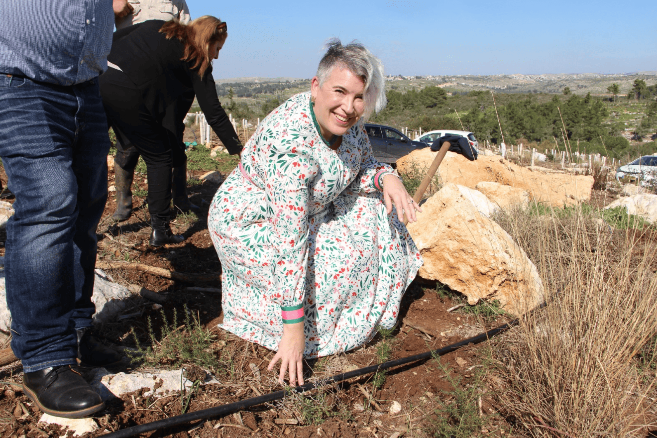 Irish Ambassador to Israel, Sonya McGuinness, plants a tree in the Ben Shemen Forest on Feb. 12, 2024. Credit: Yoav Lin, KKL-JNF Photo Archive.