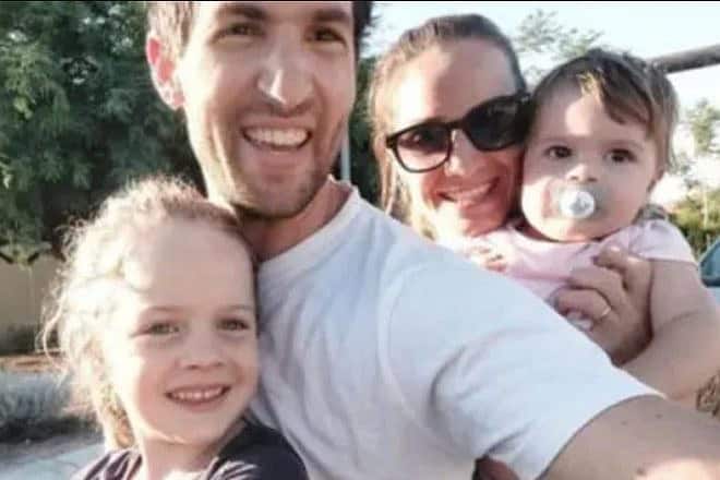 Hamas captive Sagui Dekel-Chen with his wife, Avital, and daughters Bar, 6, and Gali, 2. Credit: Courtesy of the Hostages and Missing Families Forum.