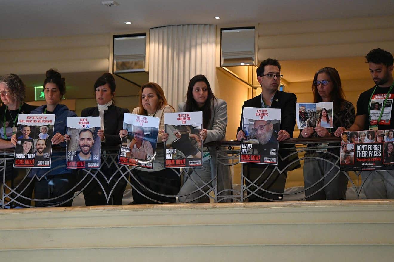 Family members of current and former Israeli hostages accompanied Israeli President Isaac Herzog to the Munich Security Conference, Feb. 17, 2024. Photo by Haim Zach/GPO.