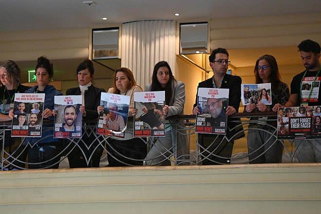 Family members of current and former Israeli hostages accompanied Israeli President Isaac Herzog to the Munich Security Conference, Feb. 17, 2024. Photo by Haim Zach/GPO.