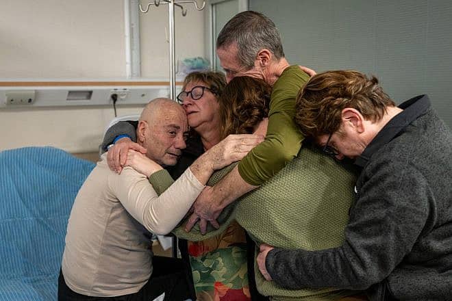 Family members of freed Israeli hostages Fernando Simon Marman and Norberto Louis Har embrace them for the first time since they were rescued from Hamas in Gaza, Sheba Medical Center in Ramat Gan, Feb. 12, 2024. Credit: IDF Spokesperson’s Unit.