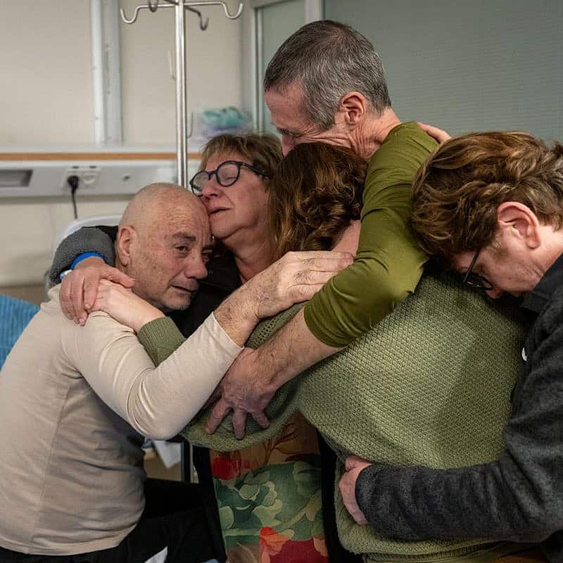 Family members of freed Israeli hostages Fernando Simon Marman and Norberto Louis Har embrace them for the first time since they were rescued from Hamas in Gaza, Sheba Medical Center in Ramat Gan, Feb. 12, 2024. Credit: IDF Spokesperson’s Unit.