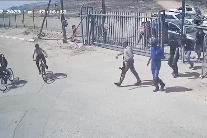Hamas terrorists and Palestinian civilian accomplices enter Kibbutz Be'eri to murder, rape and torture Jews, on Oct. 7, 2023. Source: Kibbutz Be'eri security camera.