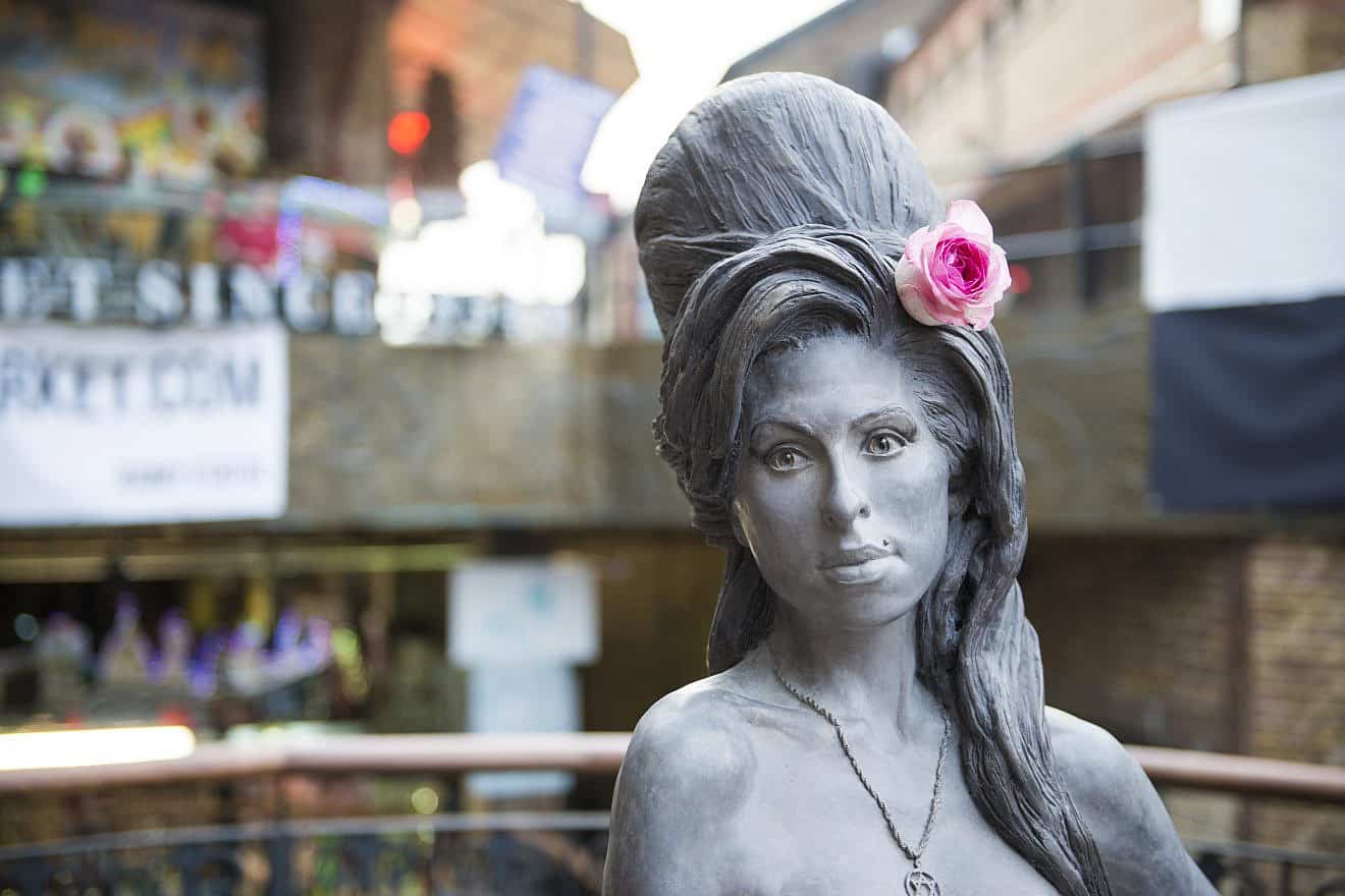 A bronze statue of Amy Winehouse in Camden Town in London. Credit: Nando Machado/Shutterstock.