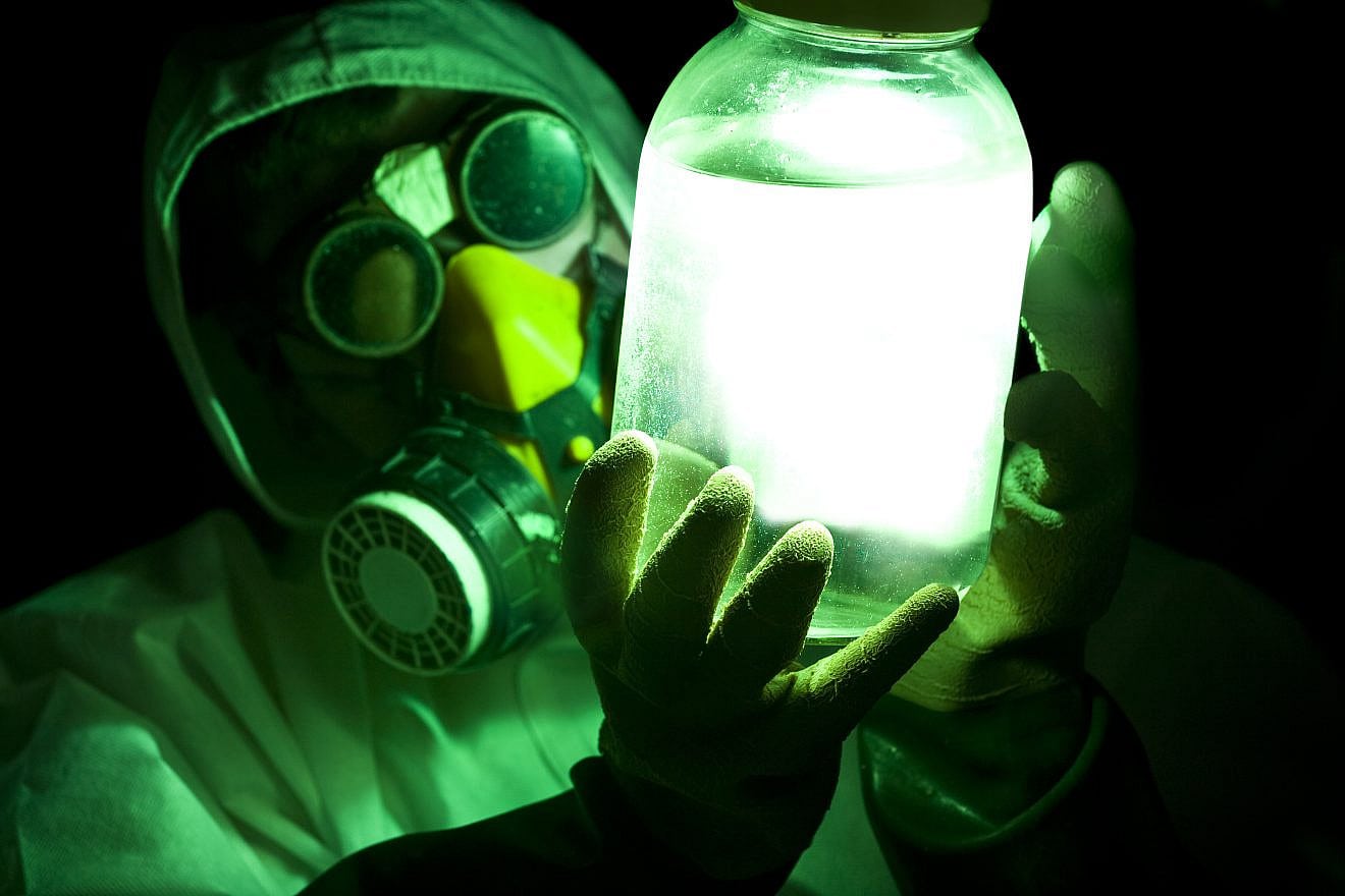 Stock illustration of a scientist holding aglowing toxic substance. Credit: S.Pytel/Shutterstock.