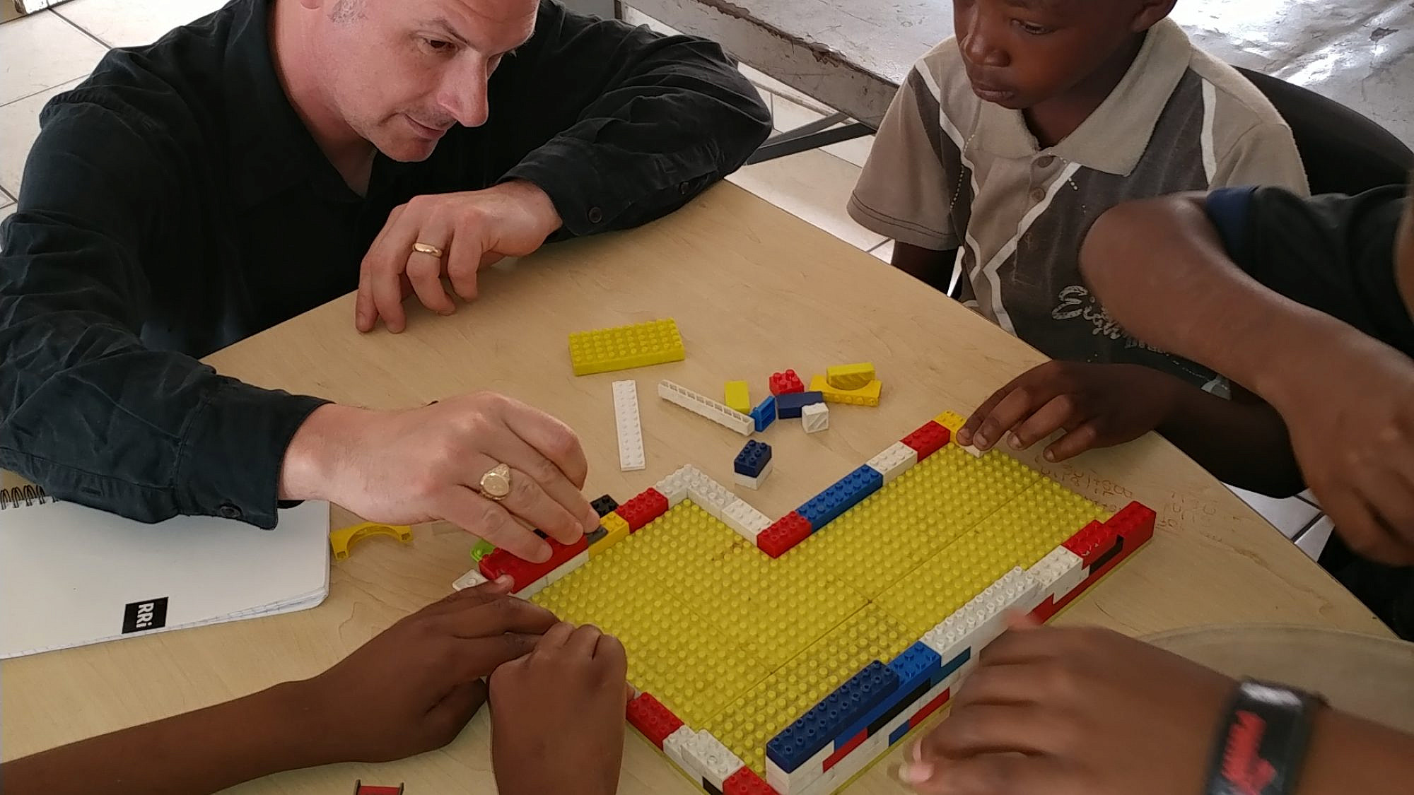 Dave Gordon with children at a learning center in Alexandra, South Africa. Credit: Courtesy.