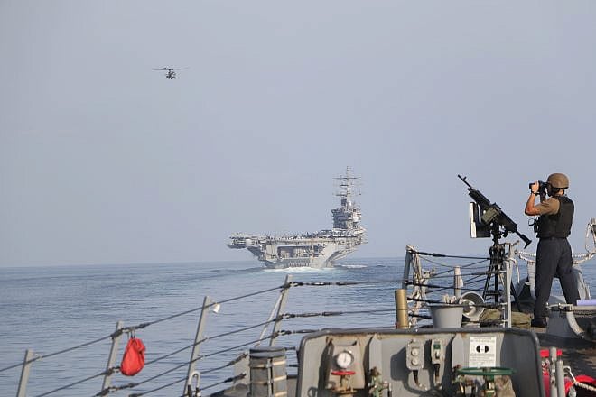 The “USS Dwight D. Eisenhower” and other naval ships in the Strait of Hormuz on Nov. 26, 2023. Credit:  Information Technician Second Class Ruskin Naval/U.S. Navy Photo.