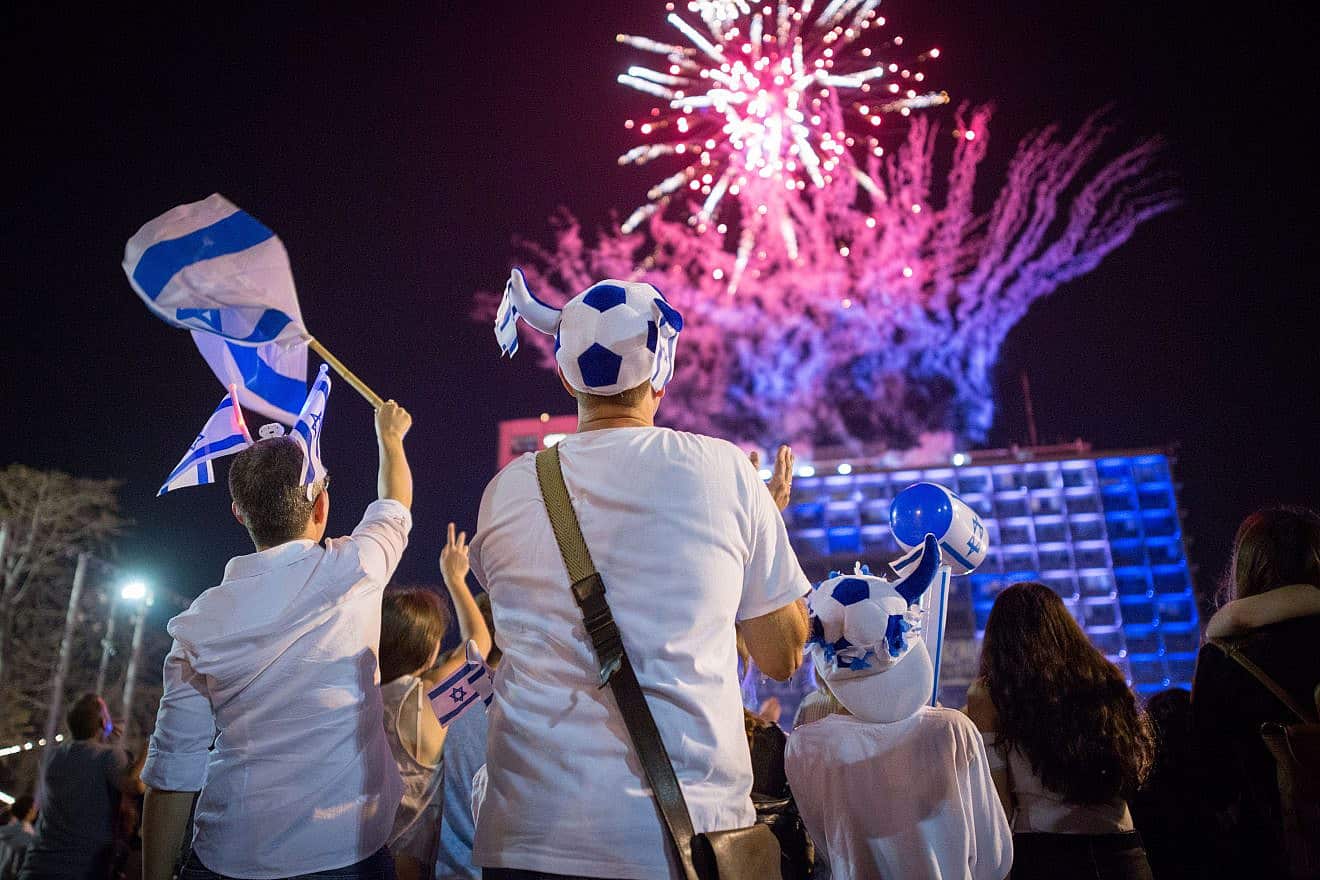 Israelis watch fireworks marking Israel's 70th Independence Day, at Rabin Square in Tel Aviv, April 18, 2018. Photo by Miriam Alster/Flash90.