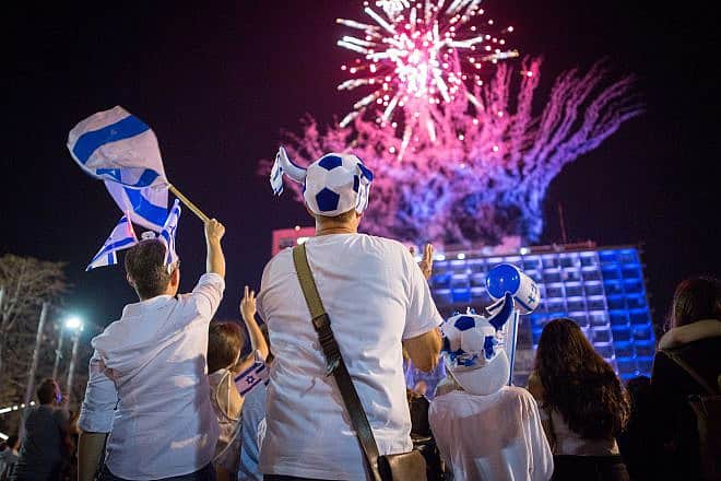 Israelis watch fireworks marking Israel's 70th Independence Day, at Rabin Square in Tel Aviv, April 18, 2018. Photo by Miriam Alster/Flash90.