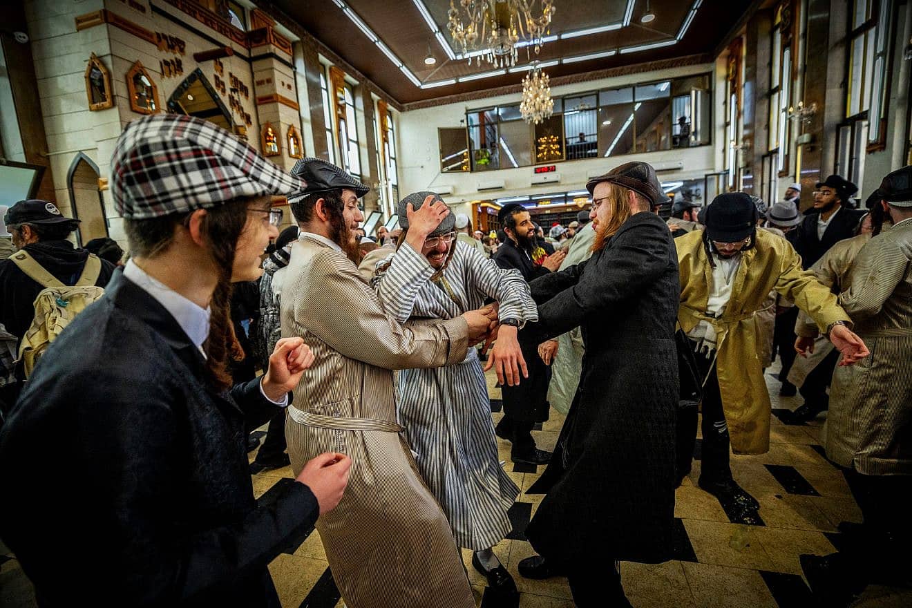 Haredi Jews celebrate Purim at a yeshivah in the Mea She'arim neighborhood of Jerusalem, March 8, 2023. Credit: Yonatan Sindel/Flash90.