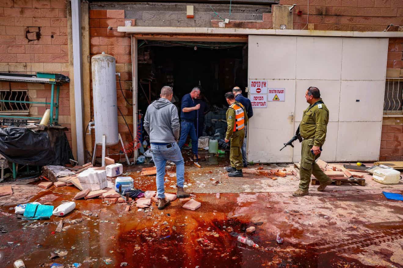 Israeli security forces survey the damage in Kiryat Shmona following a hit by a rocket from Lebanon, March 27, 2024. Photo by David Cohen/Flash90