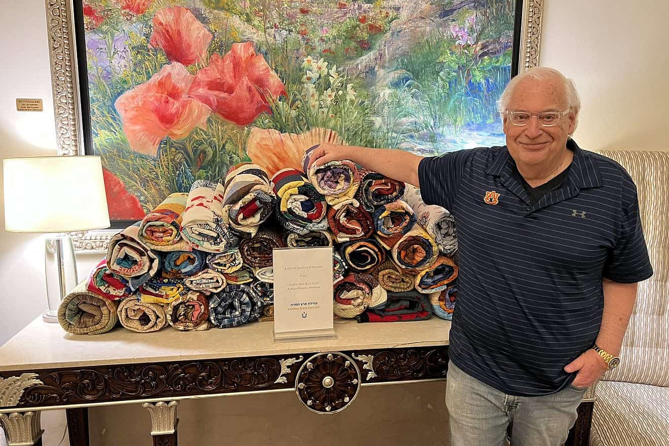 Former U.S. Ambassador to Israel David Friedman presents IDF families with handmade quilts from the Cotton Boll Quilt Guild of Auburn, Alabama, March 19, 2024. Credit: David Friedman/X.