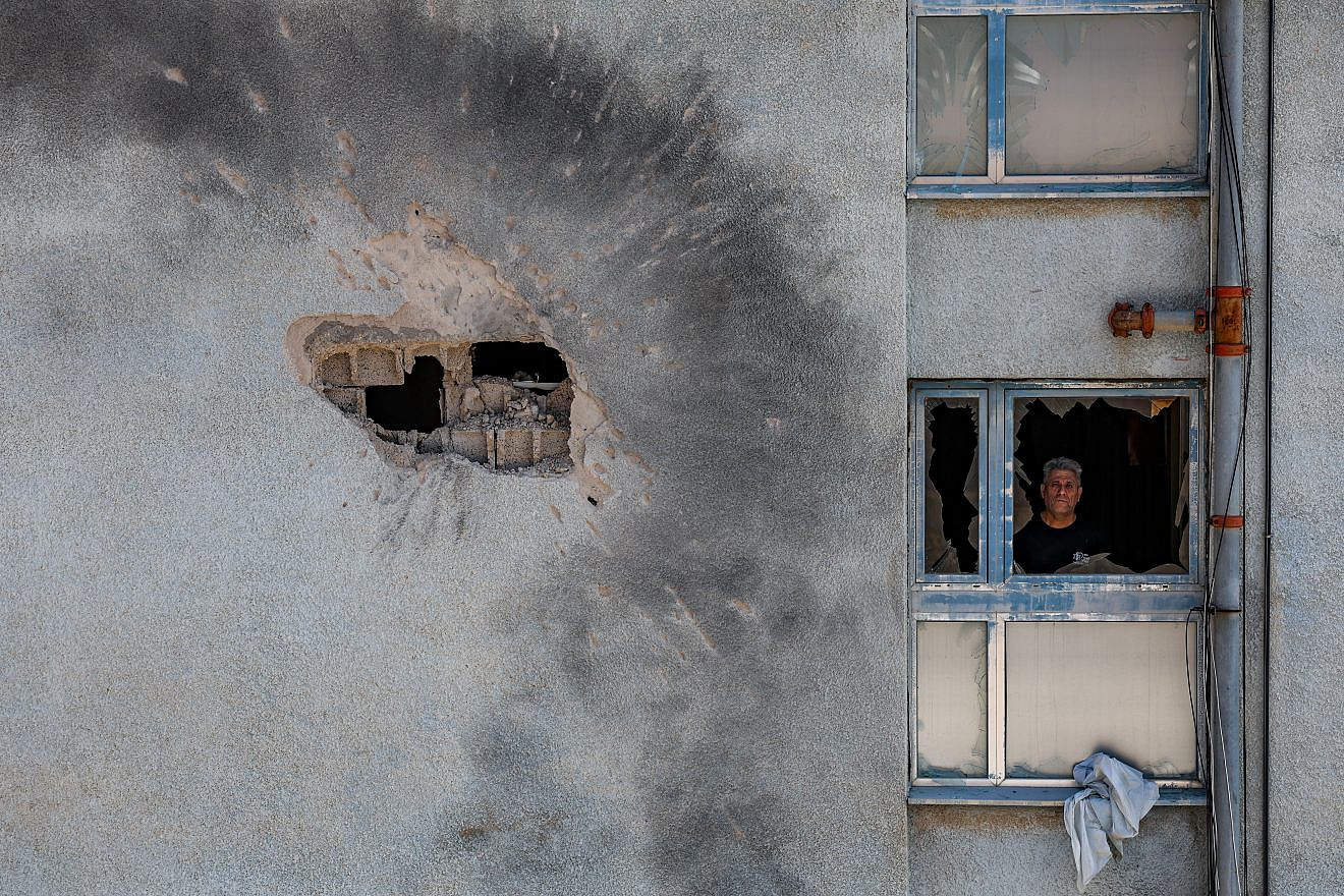 The damage after a rocket fired from Hezbollah in Lebanon hit a building in the northern Israeli town of Kiryat Shmona on Feb. 11, 2024. Photo by David Cohen/Flash90.